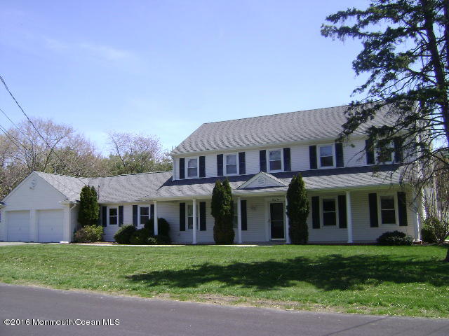 65 Skidmore Road Freehold, NJ 07728 - Photo 1 of 32 a view of a yard in front of a house