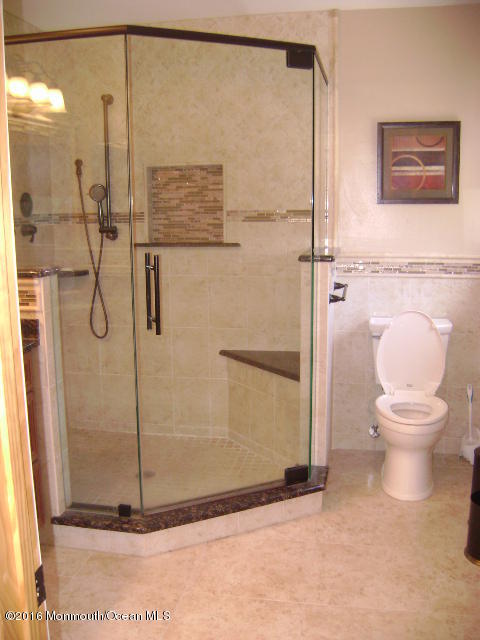 65 Skidmore Road Freehold, NJ 07728 - Photo 22 of 32 a bathroom with a toilet and a shower
