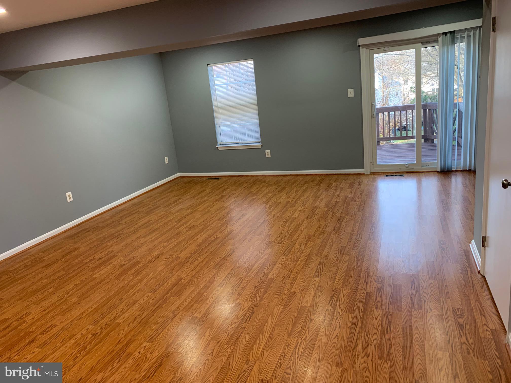 8555 Ritchboro Road District Heights, MD 20747 - Photo 12 of 30 wooden floor in an empty room with a window