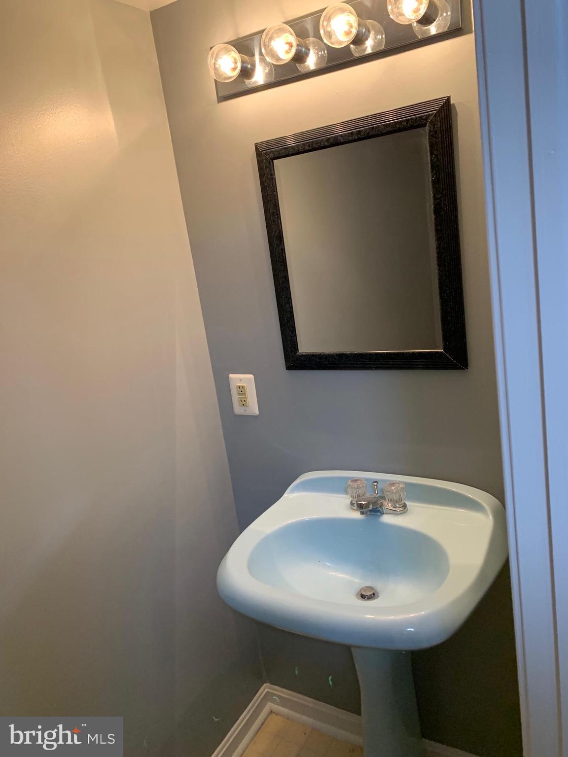 8555 Ritchboro Road District Heights, MD 20747 - Photo 23 of 30 a bathroom with a sink and mirror