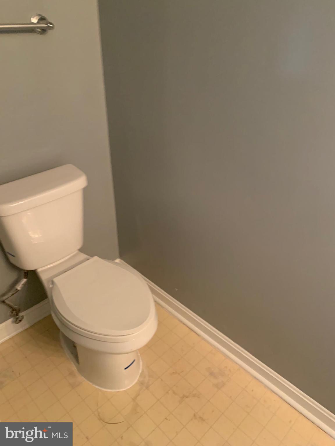 8555 Ritchboro Road District Heights, MD 20747 - Photo 24 of 30 a white toilet sitting next to a white wall