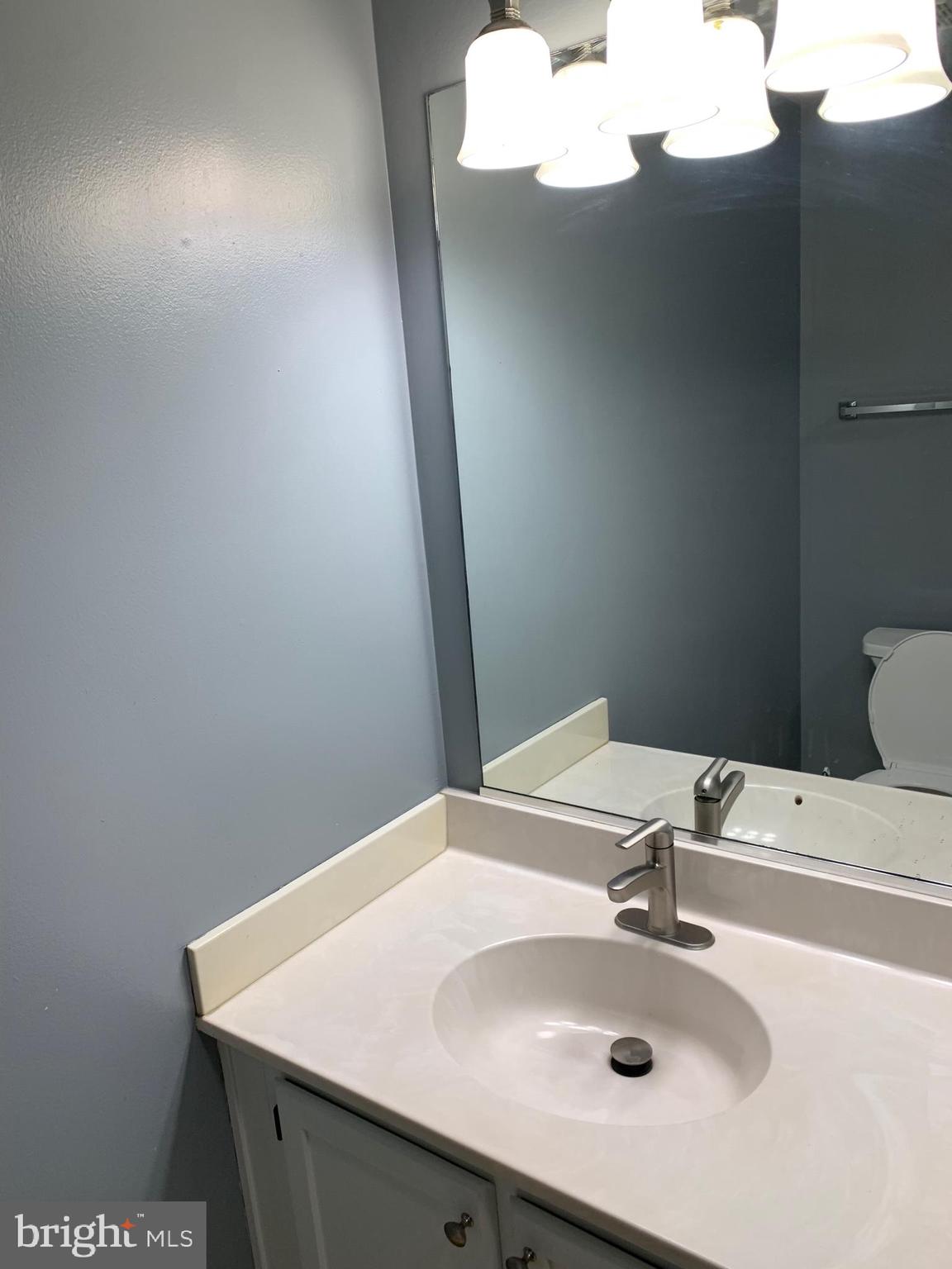 8555 Ritchboro Road District Heights, MD 20747 - Photo 25 of 30 a bathroom with a sink and vanity