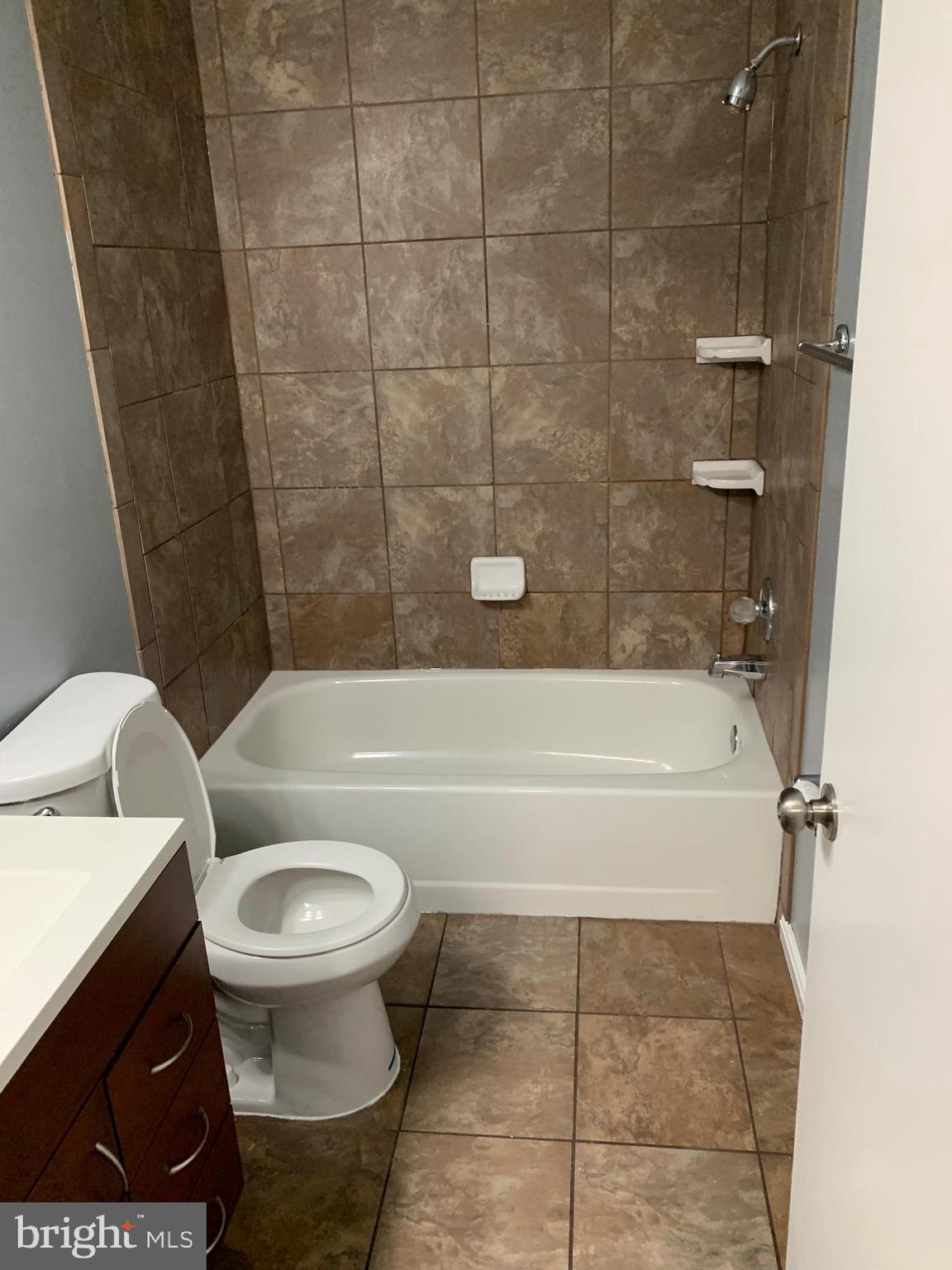 8555 Ritchboro Road District Heights, MD 20747 - Photo 30 of 30 a bathroom with a toilet and a bathtub