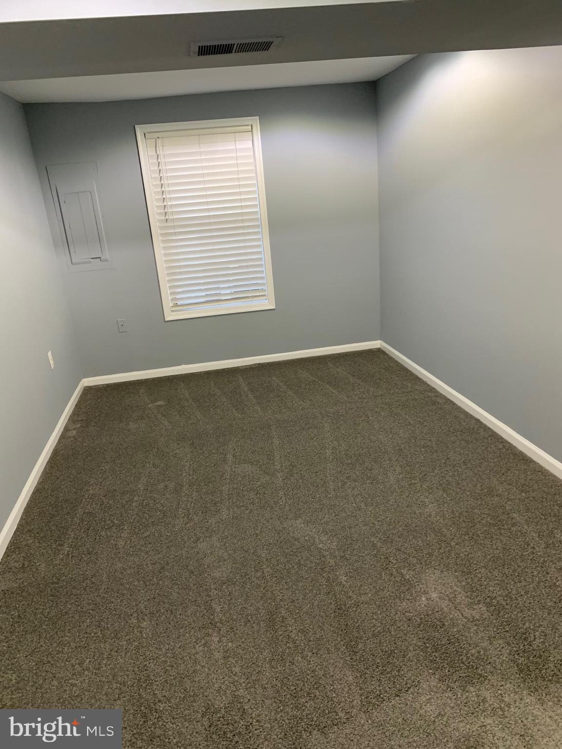 8555 Ritchboro Road District Heights, MD 20747 - Photo 9 of 30 an empty room with a window