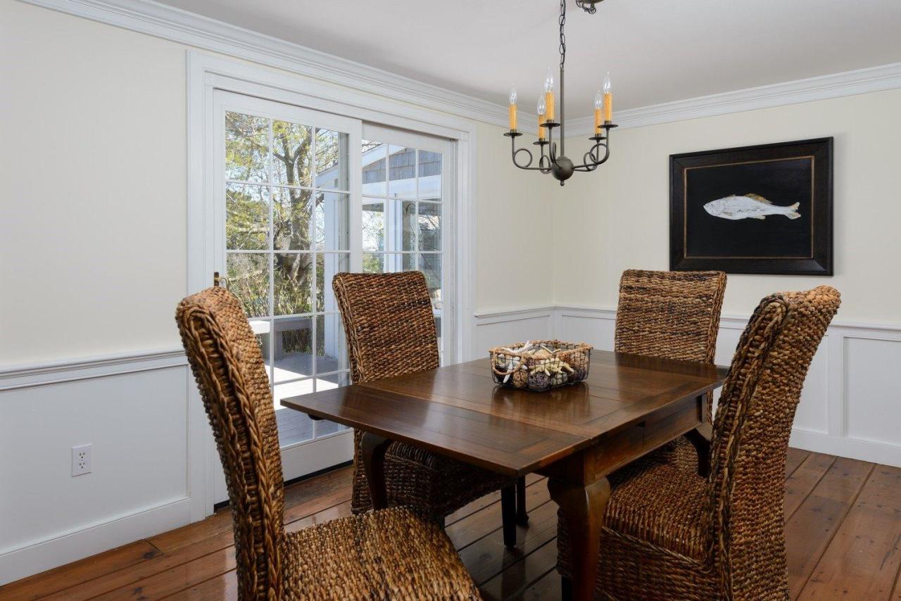 52 Salten Point Road Barnstable, MA 02630 - Photo 11 of 24 a dining room with furniture a chandelier and wooden floor