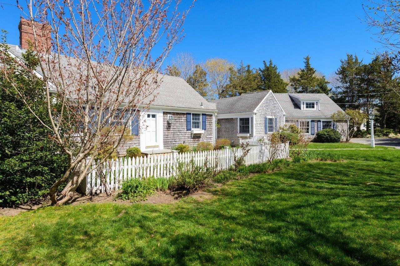 52 Salten Point Road Barnstable, MA 02630 - Photo 21 of 24 a front view of a house with a garden