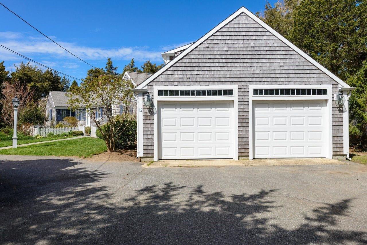 52 Salten Point Road Barnstable, MA 02630 - Photo 22 of 24 a view of a house with a yard and garage