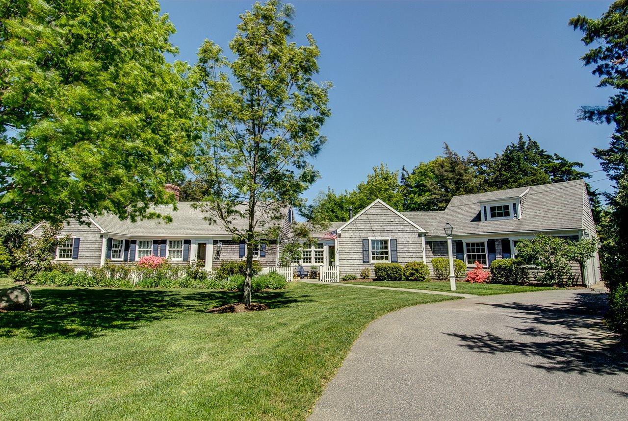 52 Salten Point Road Barnstable, MA 02630 - Photo 24 of 24 a front view of a residential houses with yard and green space