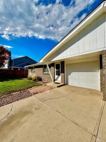 a view of a house with a street
