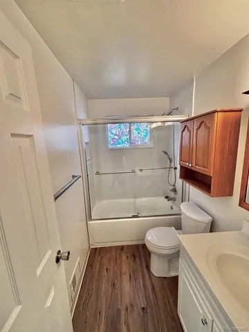 a view of a street with a yard and a fountain