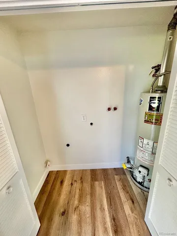 a kitchen with a stove sink and cabinets