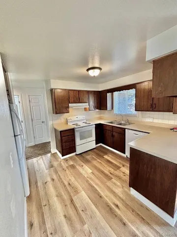 a kitchen with a stove and a microwave