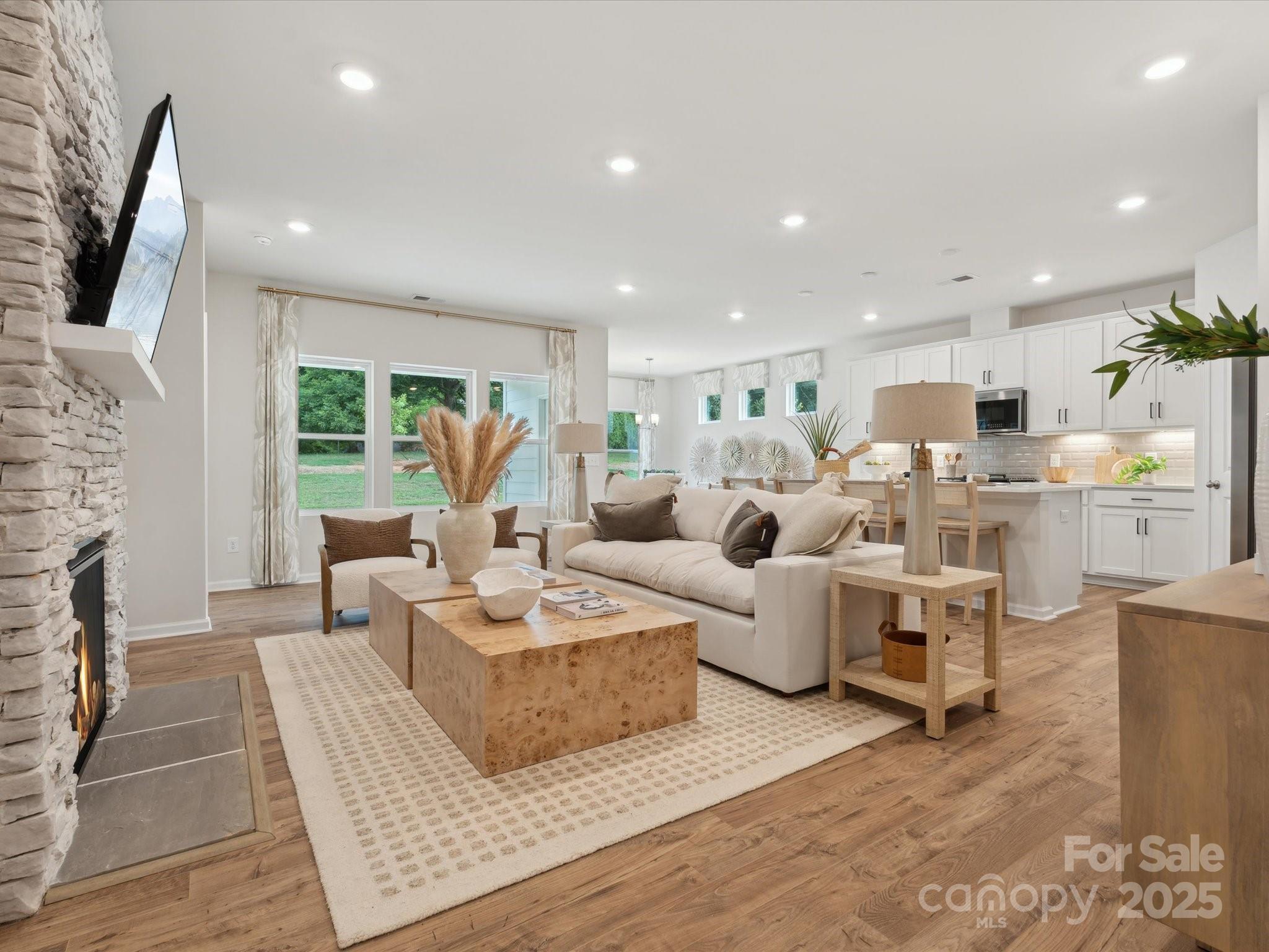 2012 Rosefield Court Matthews, NC 28104 - Photo 6 of 14 a living room with fireplace furniture and a flat screen tv