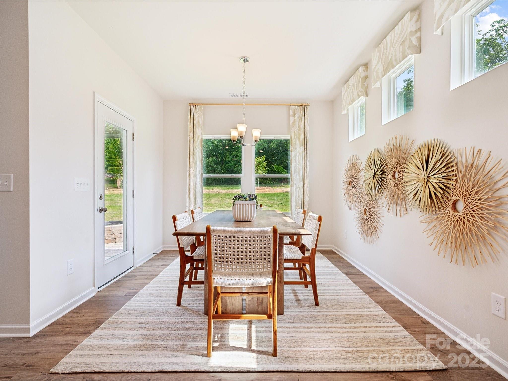 2012 Rosefield Court Matthews, NC 28104 - Photo 7 of 14 a dining room with wooden floor and window