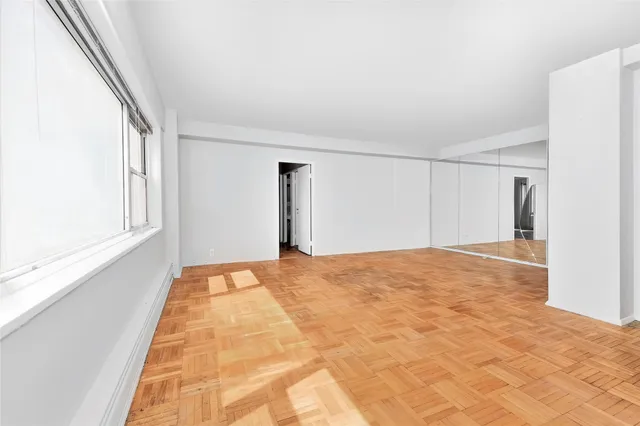 a view of an empty room and window