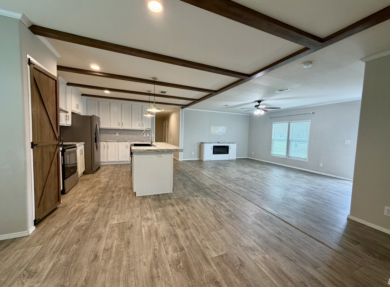 126 Castellana Way Elgin, TX 78621 - Photo 8 of 19 a view of kitchen with cabinets and wooden floor