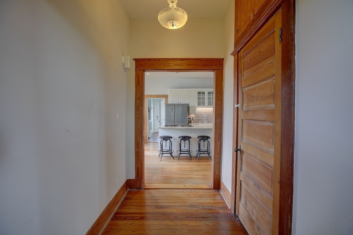 11228 Parsons Road Manor, TX 78653 - Photo 15 of 40 a view of a hallway with a livingroom and furniture