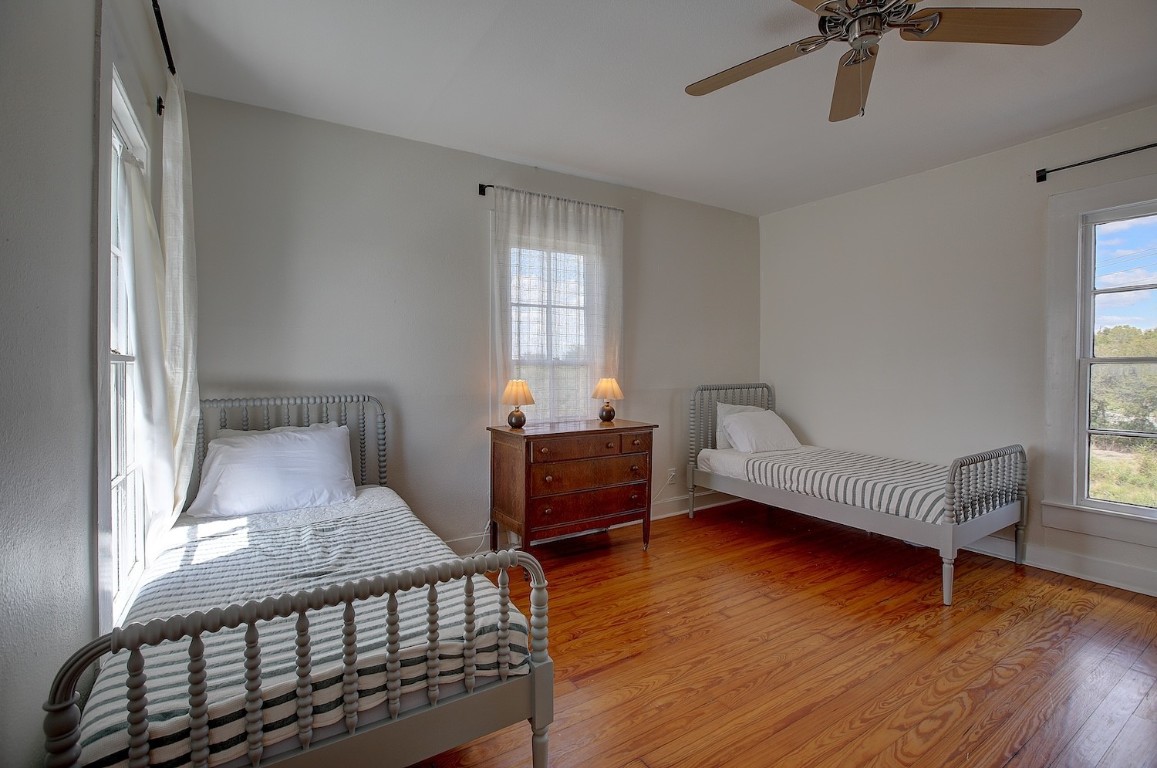 11228 Parsons Road Manor, TX 78653 - Photo 29 of 40 a bedroom with furniture and a window