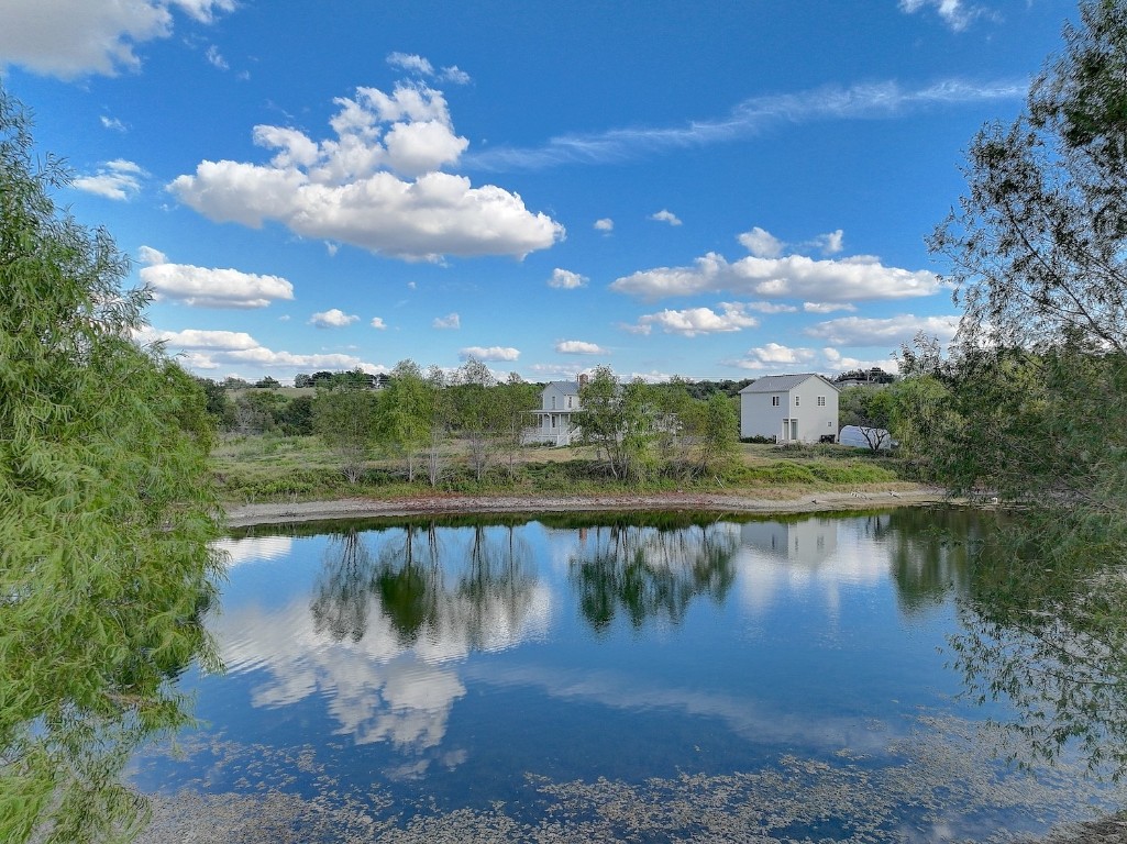 11228 Parsons Road Manor, TX 78653 - Photo 39 of 40 a view of a lake with a yard