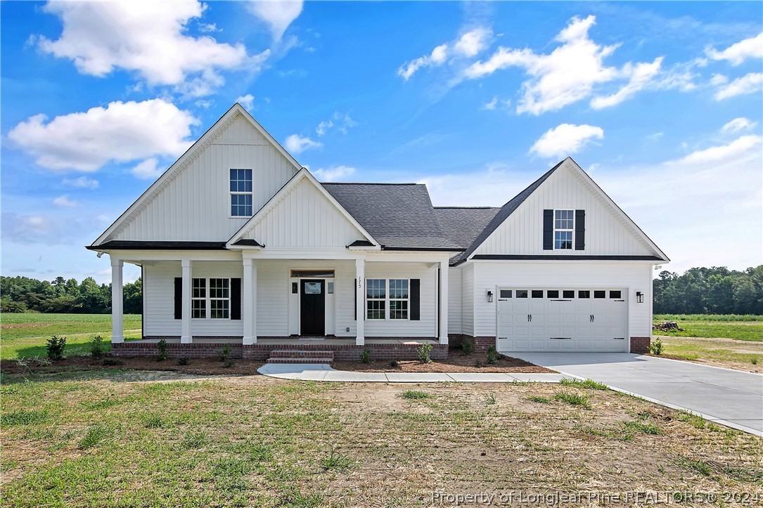a front view of a house with swimming pool and porch