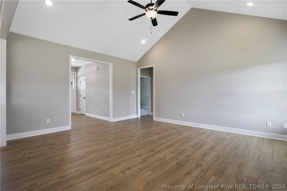 175 Spring Branch Road Tar Heel, NC 28392 - Photo 15 of 50 a view of an empty room with a window and wooden floor