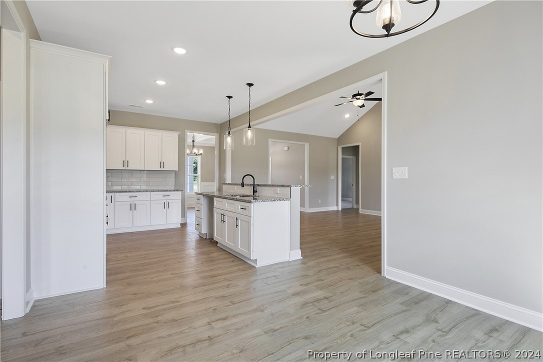 175 Spring Branch Road Tar Heel, NC 28392 - Photo 20 of 50 a view of kitchen with wooden floor