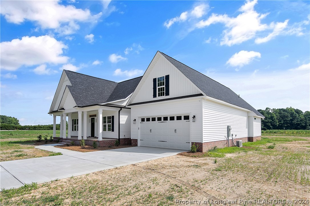 175 Spring Branch Road Tar Heel, NC 28392 - Photo 2 of 50 a front view of a house with a yard