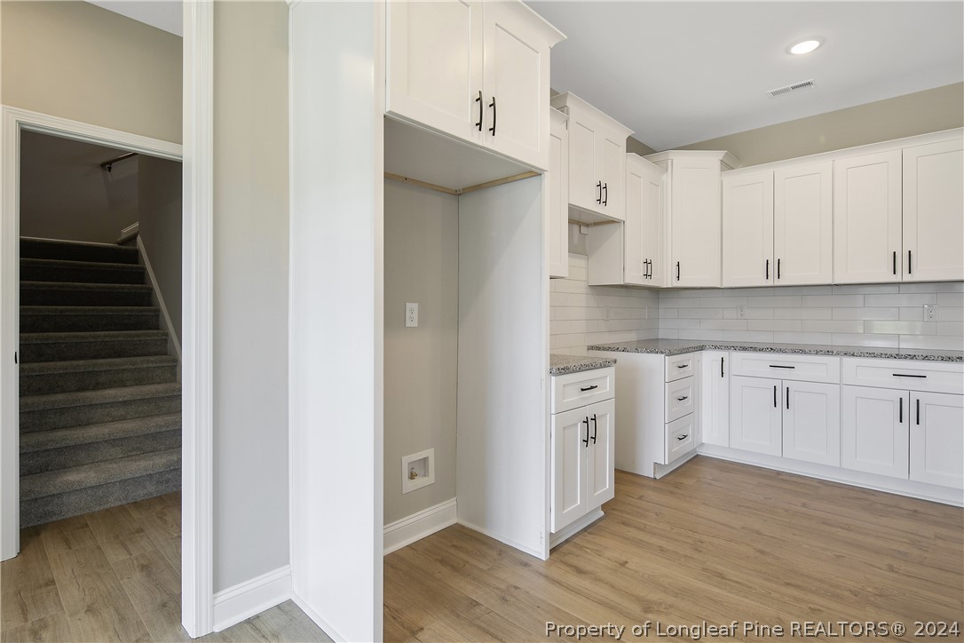 175 Spring Branch Road Tar Heel, NC 28392 - Photo 21 of 50 a kitchen with stainless steel appliances granite countertop a refrigerator and white cabinets