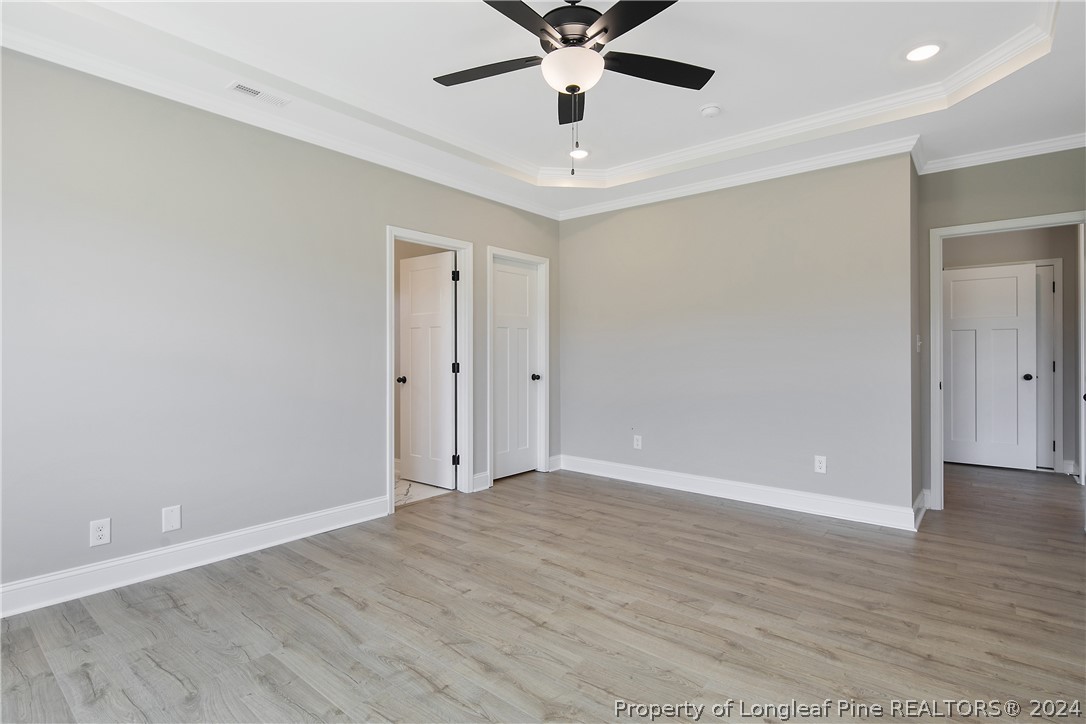 175 Spring Branch Road Tar Heel, NC 28392 - Photo 28 of 50 wooden floor in an empty room with a window