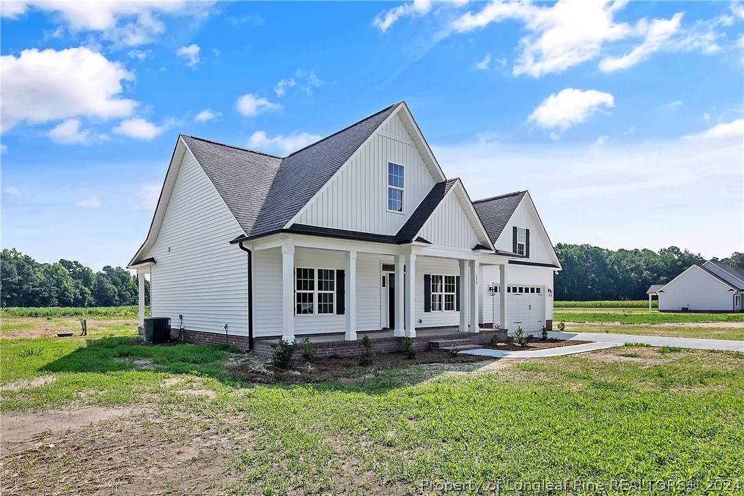 175 Spring Branch Road Tar Heel, NC 28392 - Photo 3 of 50 a front view of a house with garden