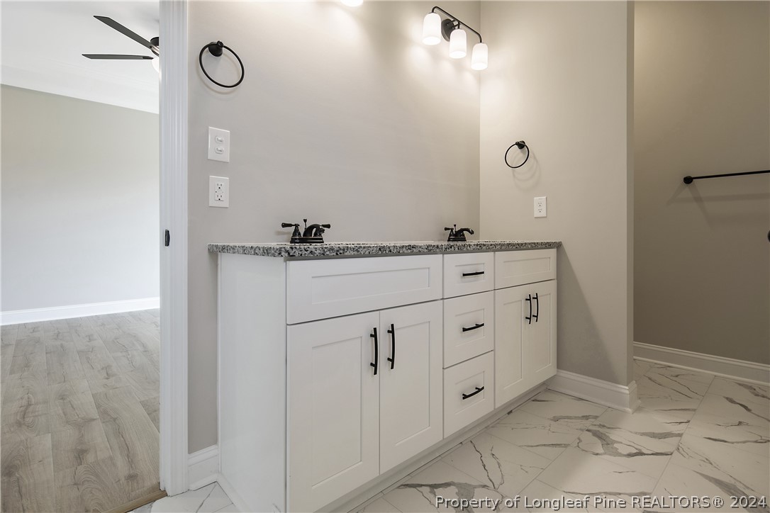175 Spring Branch Road Tar Heel, NC 28392 - Photo 31 of 50 a bathroom with double sink and mirror