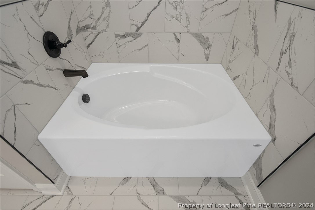 175 Spring Branch Road Tar Heel, NC 28392 - Photo 34 of 50 a bathroom with a bathtub
