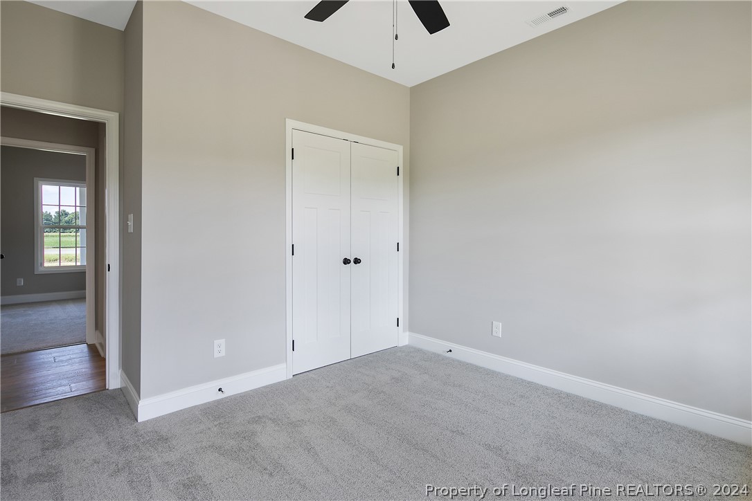 175 Spring Branch Road Tar Heel, NC 28392 - Photo 46 of 50 an empty room with a ceiling fan and entryway