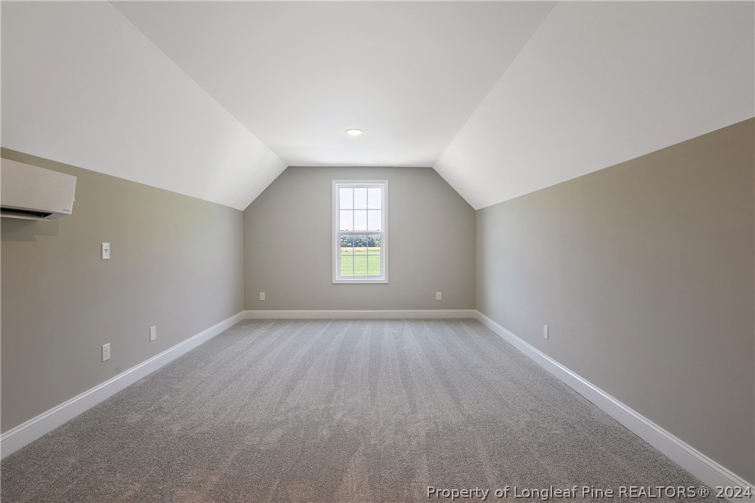 175 Spring Branch Road Tar Heel, NC 28392 - Photo 47 of 50 wooden floor in an empty room with a window