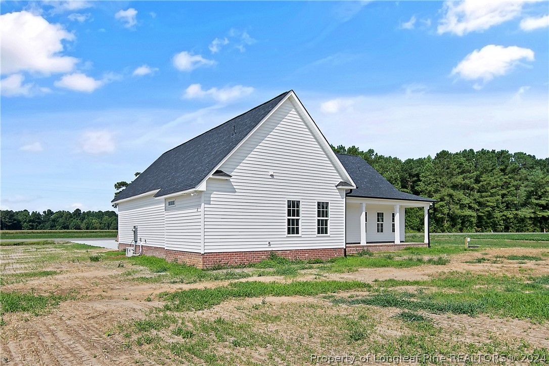 175 Spring Branch Road Tar Heel, NC 28392 - Photo 5 of 50 a view of a house with a yard