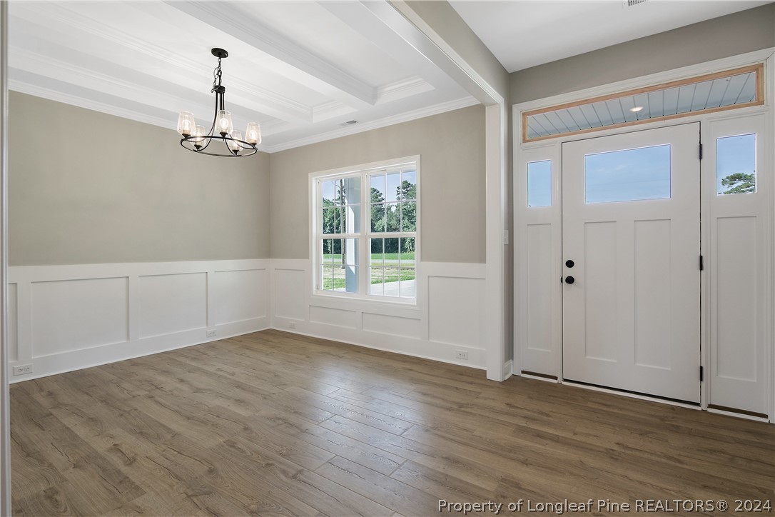 175 Spring Branch Road Tar Heel, NC 28392 - Photo 8 of 50 wooden floor in an empty room with a window