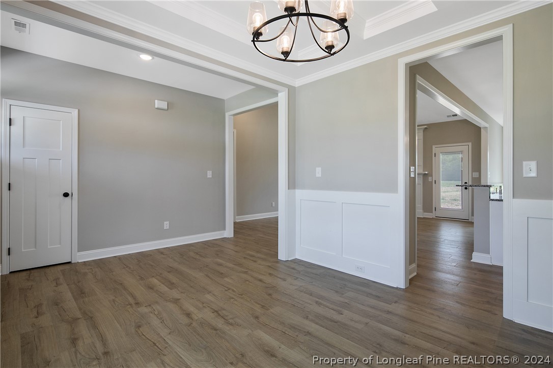 175 Spring Branch Road Tar Heel, NC 28392 - Photo 10 of 50 a view of empty room with wooden floor