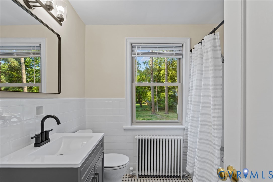 4804 Morrison Road Richmond, VA 23230 - Photo 34 of 48 a bathroom with a sink a toilet and a window