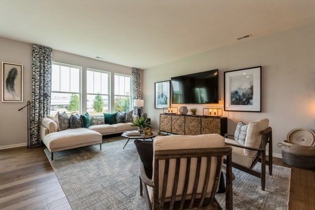 1327 Draper Road McHenry, IL 60050 - Photo 6 of 10 a living room with furniture and a flat screen tv