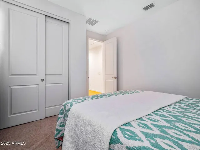 a bedroom with a bed and a shower