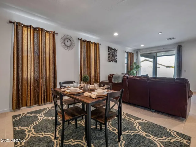 a view of a a dining room with furniture window and outside view