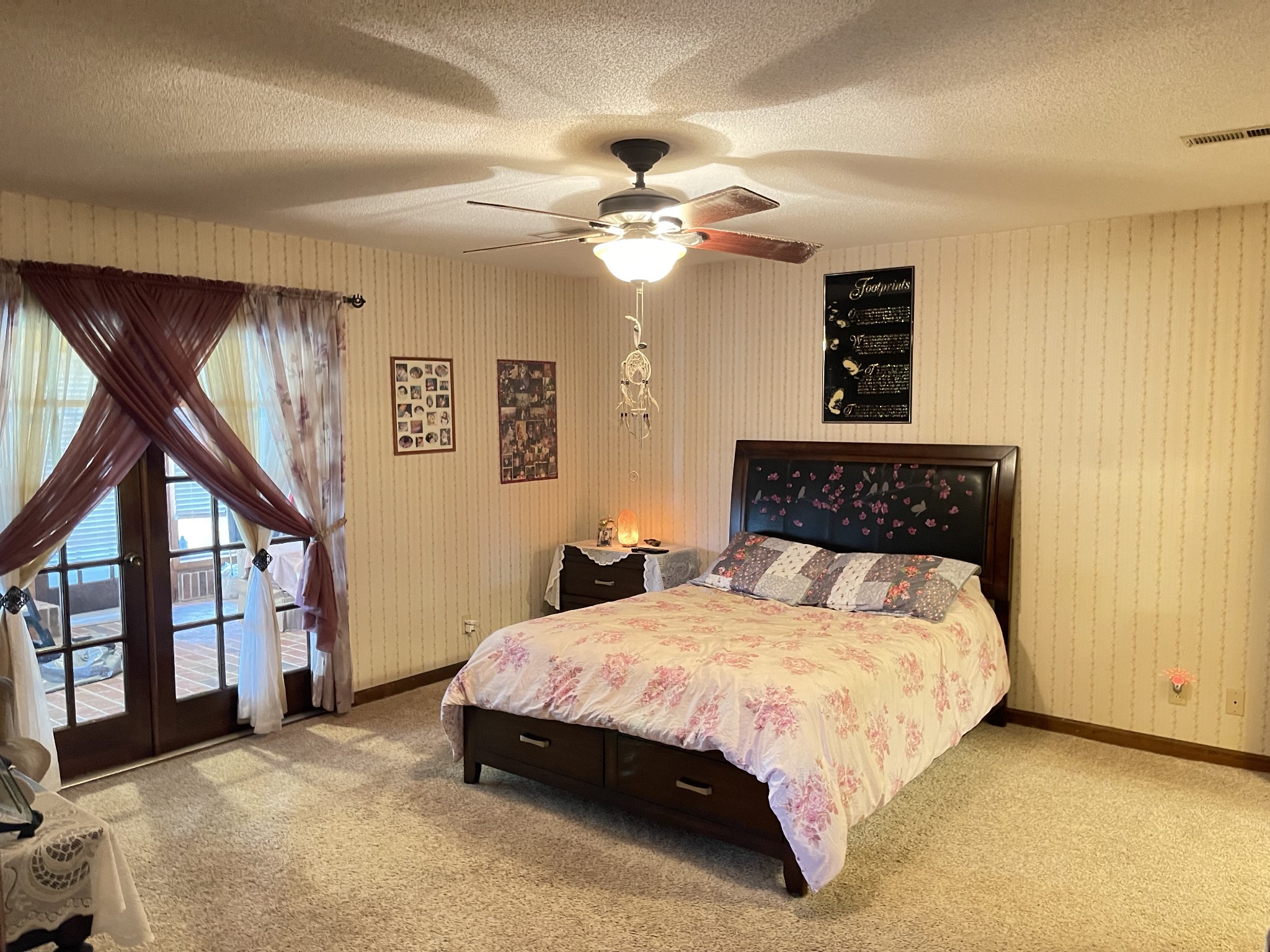 425 Corders Crossroads Road Fayetteville, TN 37334 - Photo 14 of 25 a bedroom with a large bed and a chandelier