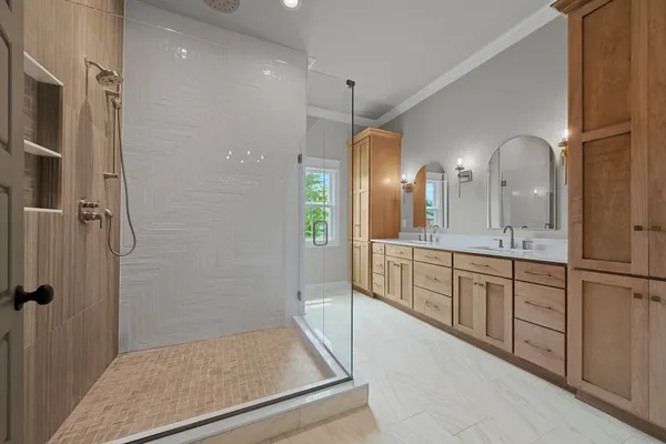 a bathroom with a double vanity sink and a mirror