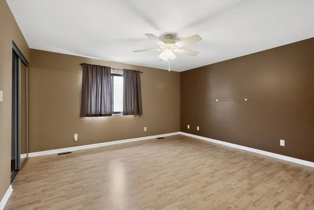 a view of an empty room with a bathroom