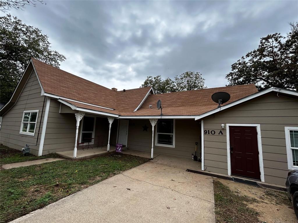 910 West Long, Unit A Stephenville, TX 76401 - Photo 1 of 39 front view of a house with a yard