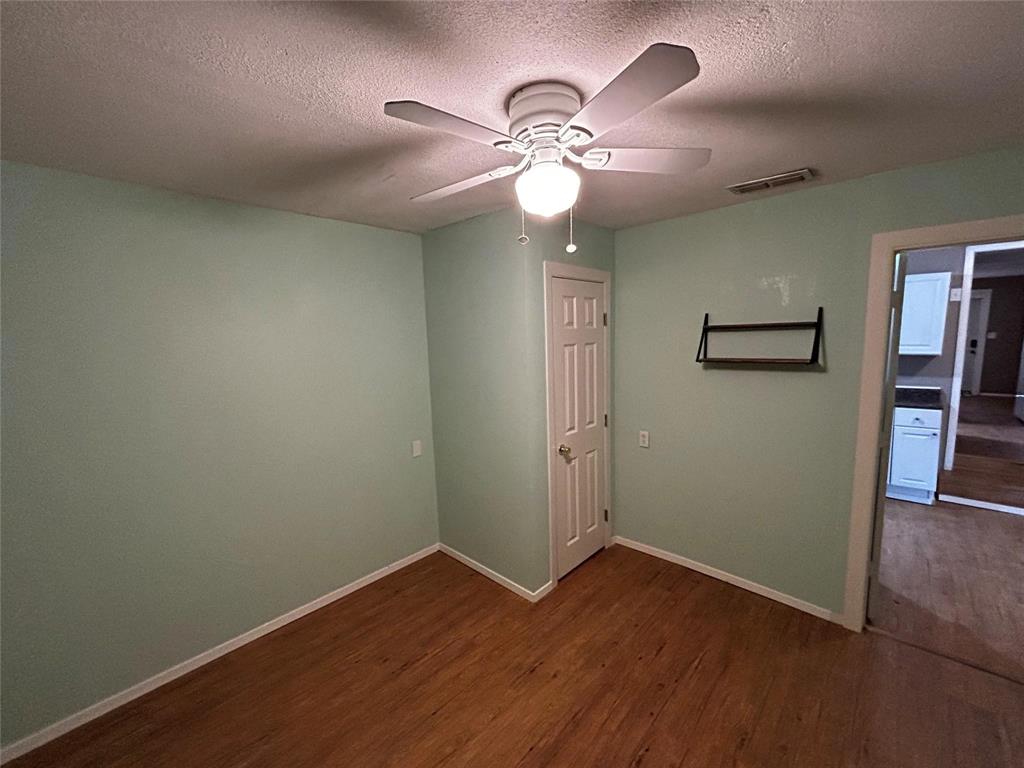 910 West Long, Unit A Stephenville, TX 76401 - Photo 11 of 39 a view of a livingroom with wooden floor