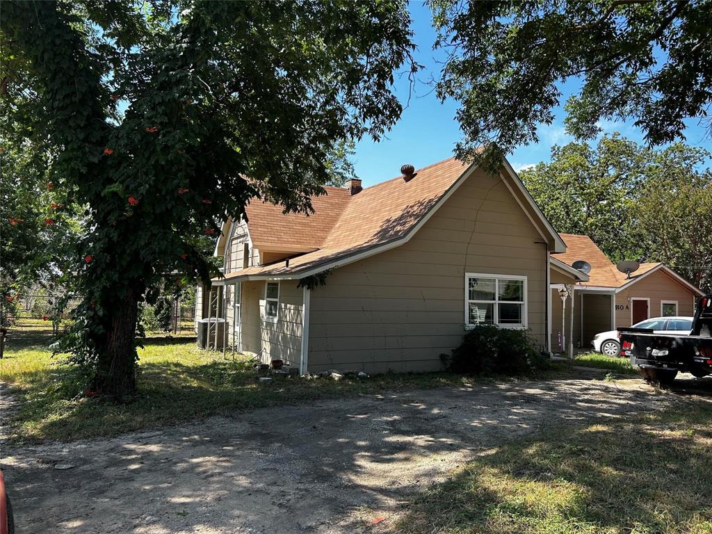 910 West Long, Unit A Stephenville, TX 76401 - Photo 2 of 39 a view of a house with a yard