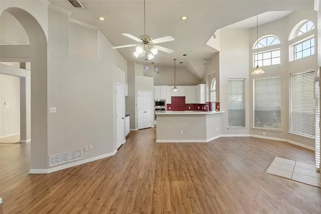 an open kitchen with a sink and dish washer