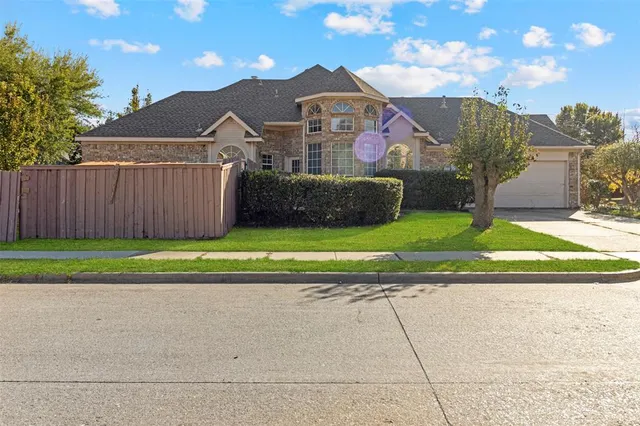 a view of a house with a yard and a garden