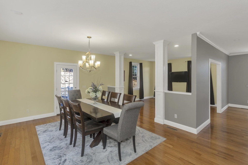 333 Stebbins Street Belchertown, MA 01007 - Photo 11 of 42 a view of a dining room with furniture and wooden floor